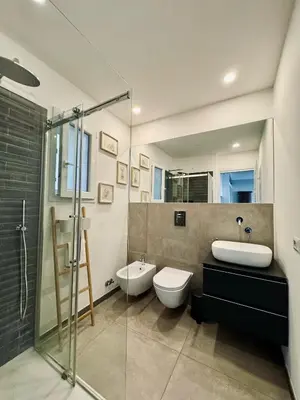 a bathroom with a sink and a toilet and a shower at The Twenty - Villaggio Olimpico apartment in Rome