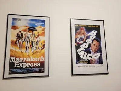 a pair of framed movie posters on a wall at Ginny's Home in Rome