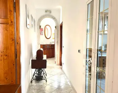 a hallway with an archway in a house at Ginny's Home in Rome