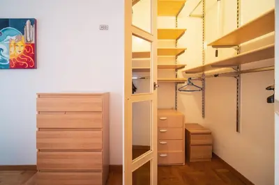 a bedroom with a large white bed with two towels at St. Peter Hill BuddyRent in Rome