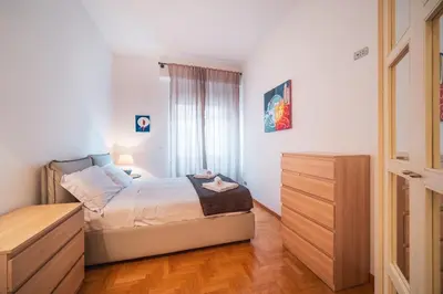 a living room with white couches and a table at St. Peter Hill BuddyRent in Rome