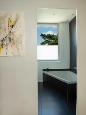a bathroom with a bath tub and a window at Room In Roma Isole in Rome