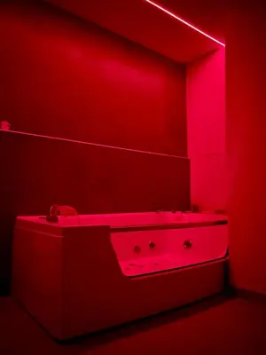 a red bathroom with a sink in a red room at San Pietro love Apartament in Rome