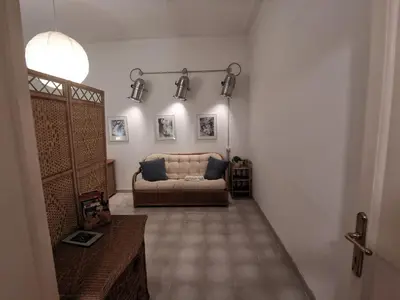 a living room with a couch and some lights at Casa Mariella Quartiere Trionfale - Prati in Rome