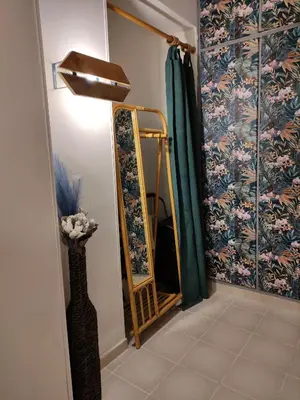 a room with a mirror and a lamp and a curtain at Casa Mariella Quartiere Trionfale - Prati in Rome