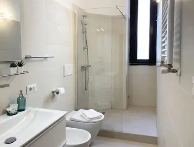 a bathroom with a shower and a toilet and a sink at RomeAsYouLike - Vatican Apartment N°73 in Rome