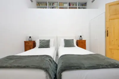two beds sitting next to each other in a bedroom at TreasureRome Opera & Trevi Grand Suite 3BR in Rome