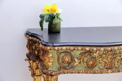 a table with a vase with a yellow flower on it at TreasureRome Opera & Trevi Grand Suite 3BR in Rome