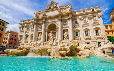 a building with a fountain in front of a building at Magenta Collection Panico 32 in Rome