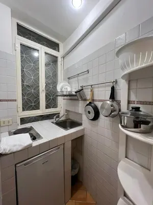 a small kitchen with a sink and a window at Magenta Collection Panico 32 in Rome