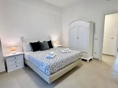 a bedroom with a bed with two towels on it at PMT Apt in Rome