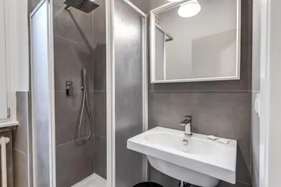 a bathroom with a sink and a shower at PMT Apt in Rome