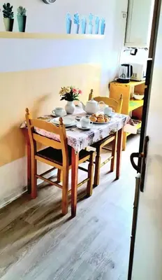 a table in a kitchen with a table and chairs at Gorgeous Flat In Pigneto in Rome