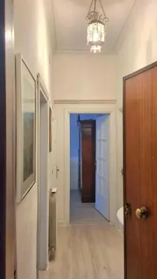 an empty hallway with a door and a chandelier at Gorgeous Flat In Pigneto in Rome