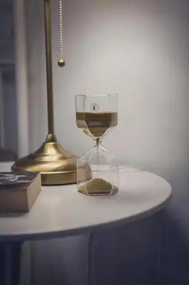 a clock sitting on top of a table at Da Alessia Per Dormire Al Coppedé in Rome
