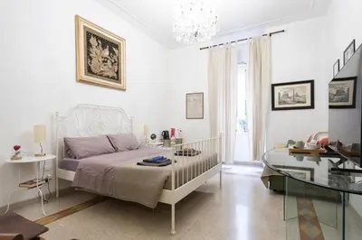 a bedroom with a bed and a glass table at Da Alessia Per Dormire Al Coppedé in Rome