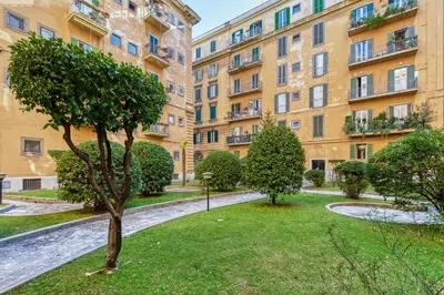 an apartment building with a park in front of it at Vespasiano Luxury apartment for 4 in Rome