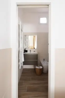 a bathroom with a tub and a sink and a toilet at Japandi Space by Nosdom Properties in Rome