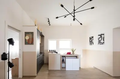 a living room with a large clock on the ceiling at Japandi Space by Nosdom Properties in Rome