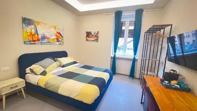 a small bedroom with a bed and a window at Ele rooms San Pietro in Rome
