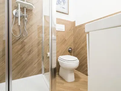 a bathroom with a toilet and a shower at Casa TPZ Metro Baldo - Close To Vatican in Rome