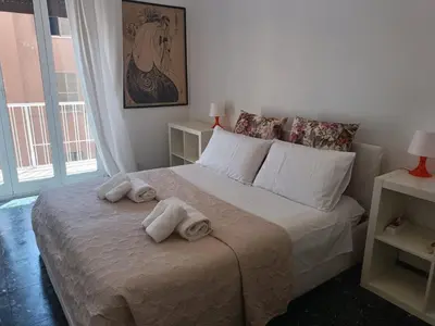 a bedroom with a bed with towels on it at Beauty apartment in the green, direct link with center in Rome