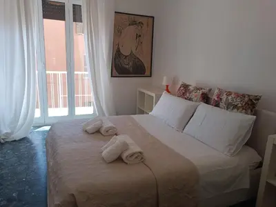 a bedroom with a bed with towels on it at Beauty apartment in the green, direct link with center in Rome