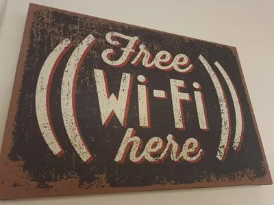 a sign with the words free wifi here at Beauty apartment in the green, direct link with center in Rome