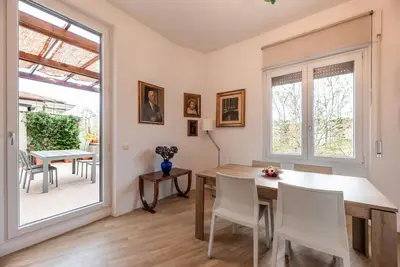 a dining room with a table and chairs at Lungotevere Testaccio Rooftop in Rome