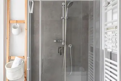 a shower with a glass door in a bathroom at Lungotevere Testaccio Rooftop in Rome