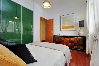 a bedroom with a bed and a glass wall at St Peter 1- Pretty Cozy Apartment (50m from metro) in Rome