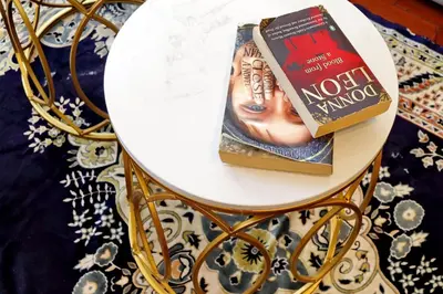 a white table with a book on top of it at St Peter 1- Pretty Cozy Apartment (50m from metro) in Rome