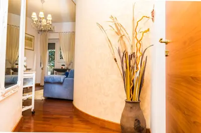 a hallway with a vase with a plant in it at S. Peter 2 - Apartment with garden -50m from metro in Rome