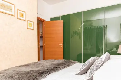 a bedroom with a bed with a glass wall at S. Peter 2 - Apartment with garden -50m from metro in Rome