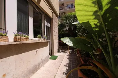 a porch with potted plants on the side of a building at S. Peter 2 - Apartment with garden -50m from metro in Rome