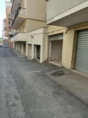 an empty street in front of an apartment building at S. Peter 2 - Apartment with garden -50m from metro in Rome