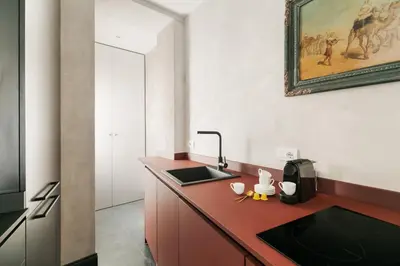 a kitchen with a sink and a counter top at Luxury apartment in Trastevere in Rome