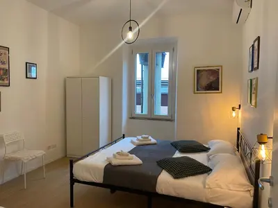 a bedroom with a bed with towels on it at Casa Arcangela by GHOR in Rome