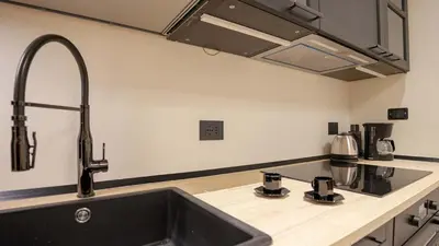 a kitchen with a sink and a counter top at Pinciana - Veneto - Marilyn House in Rome