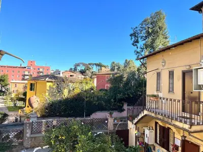 a view of a city with buildings and trees at The Fontana Carlotta at Garbatella in Rome