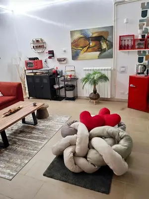 a living room with a large couch in the middle at la Borghese in Rome