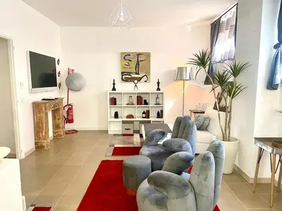 a living room with a couch and a red rug at la Borghese in Rome
