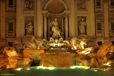 a large fountain with statues in front of a building at Sofia's Suites Guesthouse in Rome
