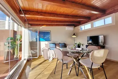 a dining room with a table and chairs at Terrace Mariù Apartment in Rome