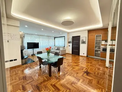 a living room with a table and a couch at LUXURY AV in Rome