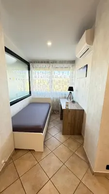 a small room with a bed and a table at LUXURY AV in Rome