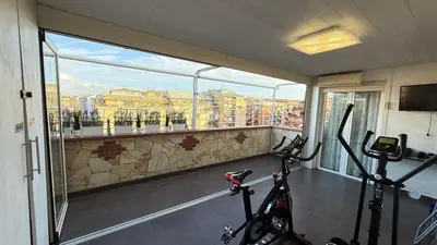 a room with two bikes in a room with a balcony at LUXURY AV in Rome