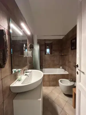 a bathroom with a sink and a tub at Vacanze Romane in Rome