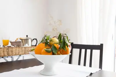 a bowl of oranges sitting on a table at Vacanze Romane in Rome