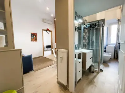 a bathroom with a sink and a toilet and a mirror at San Lorenzo 47 Loft in Rome